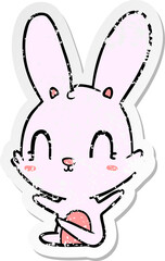 distressed sticker of a cute cartoon rabbit