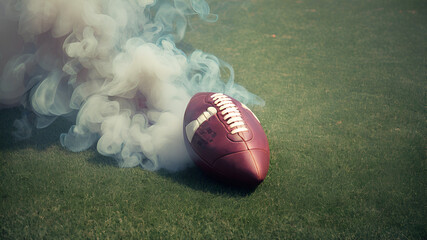 Football Resting on Vibrant Green NFL Field with smoke,
