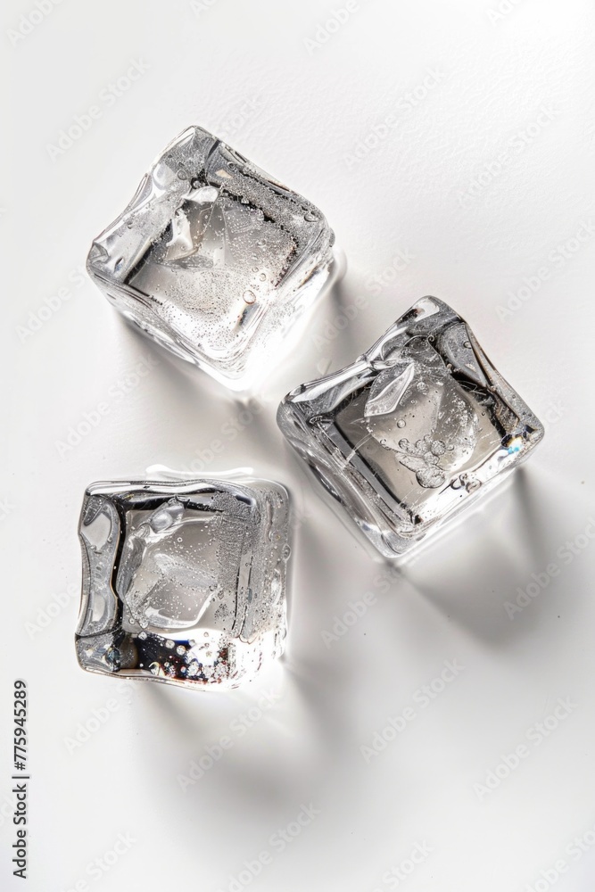 Poster three ice cubes on a white surface, versatile for various projects