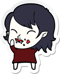 sticker of a cartoon vampire girl with blood on cheek