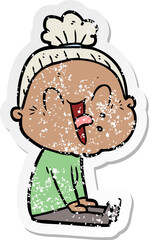 distressed sticker of a cartoon happy old woman