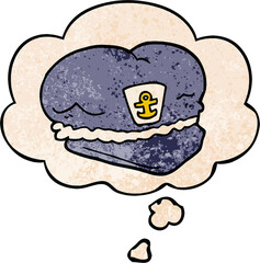 cartoon sailor hat with thought bubble in grunge texture style