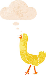cartoon bird with thought bubble in grunge distressed retro textured style
