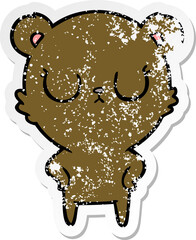 distressed sticker of a peaceful cartoon bear