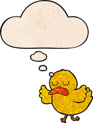 cartoon duck with thought bubble in grunge texture style