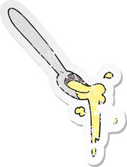retro distressed sticker of a cartoon spoonful