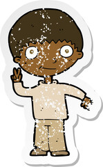 retro distressed sticker of a cartoon boy giving peace sign