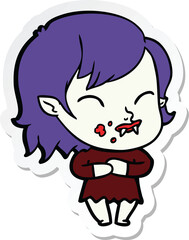 sticker of a cartoon vampire girl with blood on cheek
