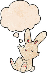 cartoon rabbit sleeping with thought bubble in grunge texture style