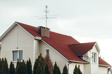 Satellite antenna and old roof antenna