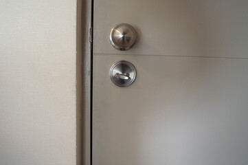 a white door and a wall of an apartment