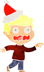 hand drawn retro cartoon of a stressed out pointing wearing santa hat