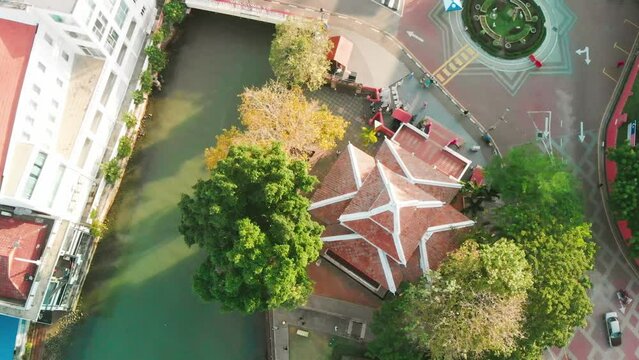 Malacca river and skyline on a sunny day, aerial view from drone