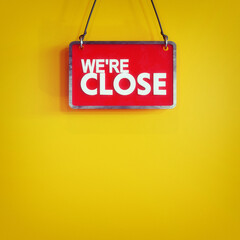 store close sign 3d render. modern signage on yellow background, white text on red board 