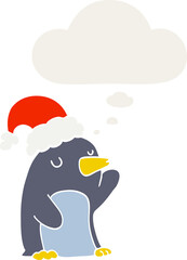 cute cartoon christmas penguin with thought bubble in retro style