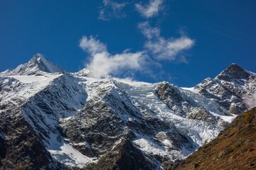 Fototapeta na wymiar Snow covered peaks of the Swiss Alps on a sunny day, Switzerland