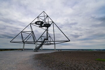Closeup shot of the Tetraeder Tower in Bottrop, Germany, on a rocky field