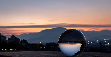 Panorama view of a crystal ball with the mountains as a background