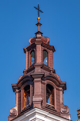 Beautiful view of a Catholic church tower under a blue sky