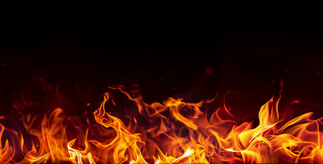 Massive fire burning in darkness. Seamless border with flame on a black background for banner. Red, orange, yellow colors.