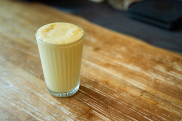 Delicious Yellow Smoothie made from Milk and Yoghurt with copy space for text input