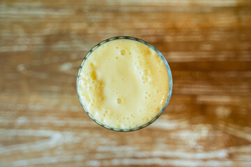 Delicious Yellow Smoothie made from Milk and Yoghurt with copy space for text input