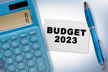 Budget 2023 concept with note, calculator and pen on the table