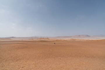 Fototapeta na wymiar person walking in desert