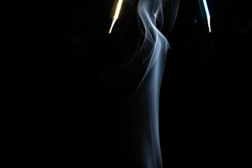 Fototapeta premium Yellow and green pencils with smoke on black background