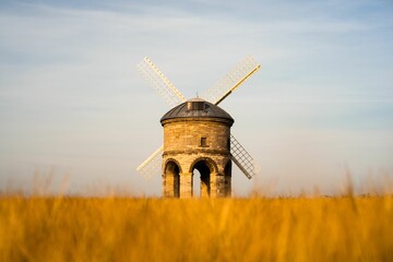 Beautiful view of a Chesterton Windmill in the yellow dry field