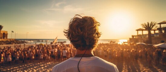 beach party DJ festival portrait with crowd of people in the background