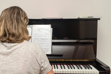 Professional female pianist playing the piano