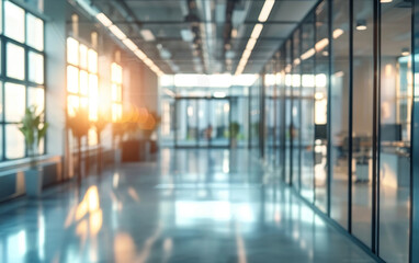 The warm, golden light of the sun streams through the glass walls of a modern office space, illuminating the threshold and creating a welcoming and bright environment. - obrazy, fototapety, plakaty