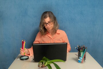 Female concentrated with laptop computer working from home or office