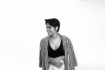 Grayscale portrait of a businesswoman in a formal outfit  in front of a white background