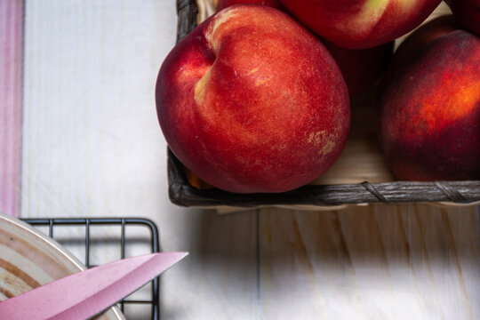 Top view of a basket of pelones, plate and knife.