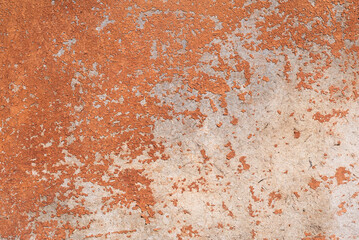 Old shabby door with cracked brown paint.