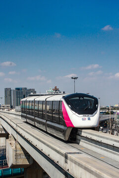 Bangkok, Thailand - January 05 2024, Pink Line monorail train in the capital Bangkok, blue sky, skytrain, electric train.