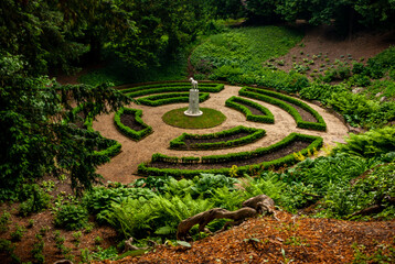 Urban maze park with statue in the center of it