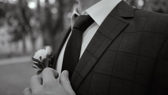 morning of the groom in a beautiful jacket and boutonniere before the wedding ceremony and meeting the bride