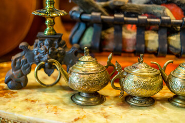 background of decorative items such as cups, plates, various animal statues, vintage sofas, that are decorated in the current cafe, is beautiful and allows customers to stop and take photos