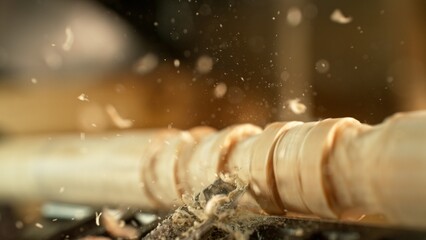 Close-up of carving wood with a chisel. Low depth of focus, super macro shot.