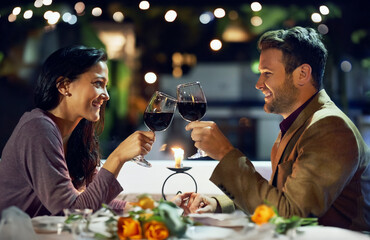 Smile, couple and cheers with wine at restaurant for date, love or holding hands together. Happy...