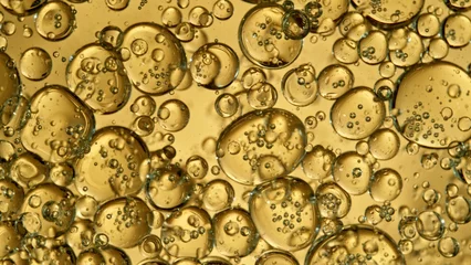  Freeze Motion Shot of Moving Oil Bubbles on Golden Background © Lukas Gojda