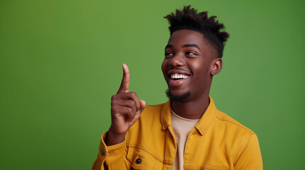 a hand pointing finger, young ebony man, smiling,