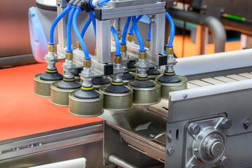 The high technology material handling process in canned food production by robotic system.