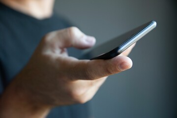 Closeup of a hand holding a smartphone