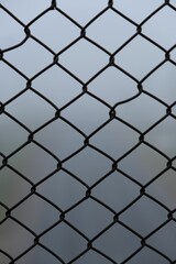 Vertical closeup shot of details on a metal fence