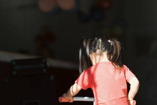 Closeup view of a little girl from backward