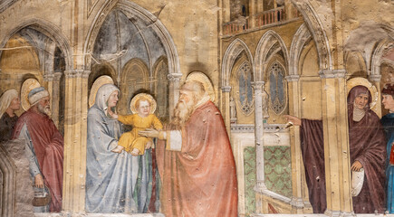 Detail of religious fresco showing Virgin Mary introducing baby Jesus to a man